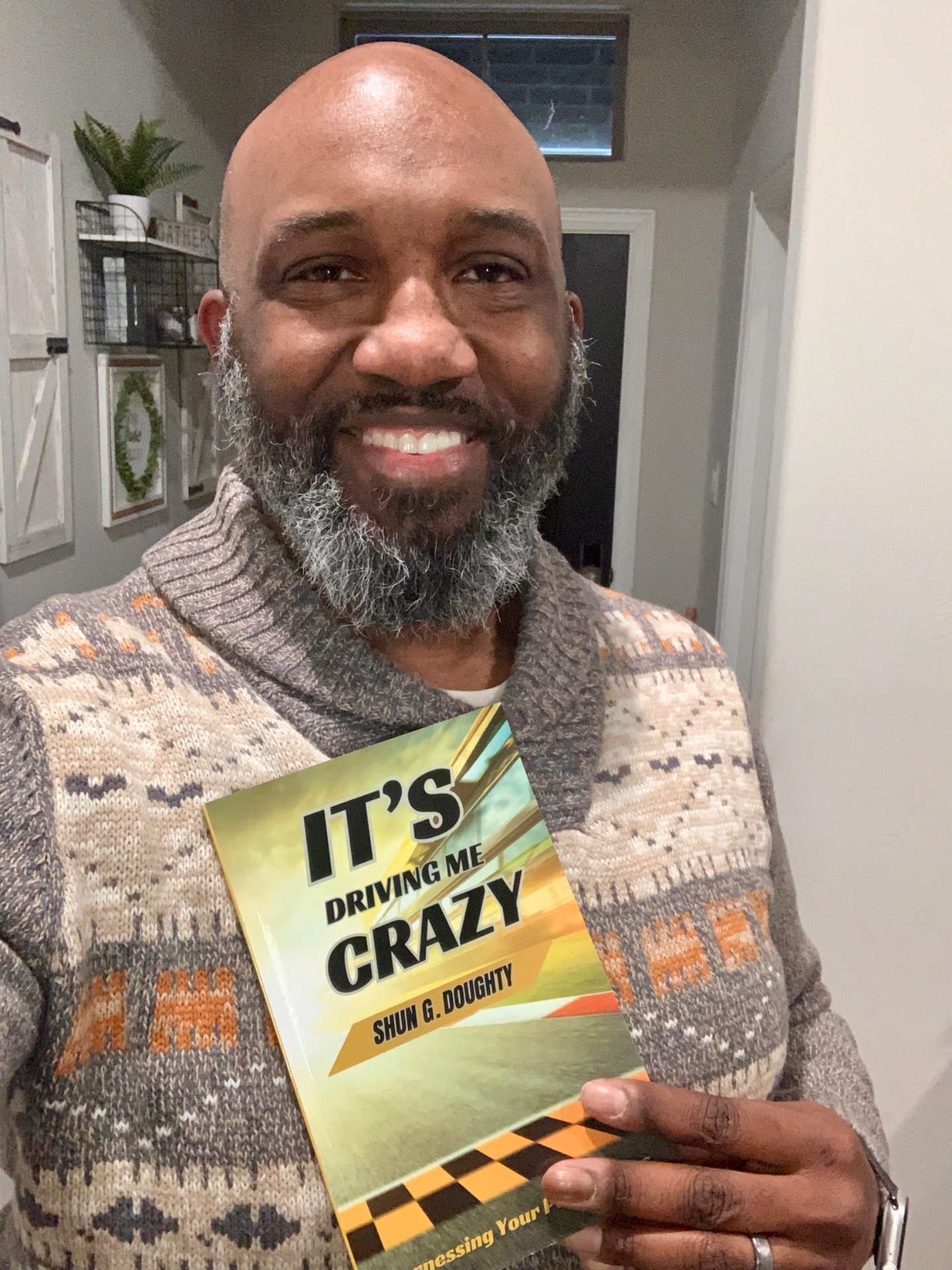 Shun Doughty with his book